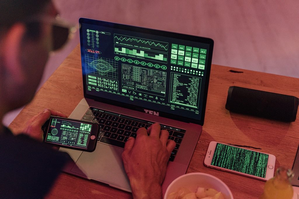 Business professional working on cybersecurity decisions at a computer